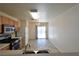 Bright eat-in kitchen boasts neutral walls, white cabinets and a view to the backyard at 2845 Kensington St, Las Vegas, NV 89156