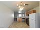 Bright eat-in kitchen featuring neutral walls, pendant lighting and stainless appliances at 2845 Kensington St, Las Vegas, NV 89156