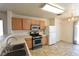 Eat-in kitchen with modern appliances, white cabinets and slider door access to patio at 2845 Kensington St, Las Vegas, NV 89156