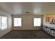 Bright, open living room with breakfast bar and carpet flooring throughout at 2845 Kensington St, Las Vegas, NV 89156
