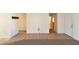 Open living room featuring neutral walls, tile entry, with carpet flooring at 2845 Kensington St, Las Vegas, NV 89156