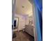 Bathroom with wood-look flooring, granite vanity and modern grey cabinets at 2872 Atomic Tangerine Way # 2, Las Vegas, NV 89183