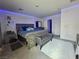 Comfortable bedroom featuring neutral colors, carpet and LED lighting accenting the space at 2872 Atomic Tangerine Way # 2, Las Vegas, NV 89183