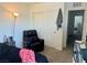 Bedroom with chair, carpet, lamp, and large closet at 2872 Atomic Tangerine Way # 2, Las Vegas, NV 89183