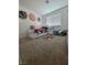 Bright bedroom with sports decor, carpet flooring, and a white single bed at 2872 Atomic Tangerine Way # 2, Las Vegas, NV 89183