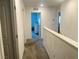 Hallway with carpet and white walls leading into bedrooms at 2872 Atomic Tangerine Way # 2, Las Vegas, NV 89183