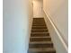 Carpeted staircase with railing at 2872 Atomic Tangerine Way # 2, Las Vegas, NV 89183