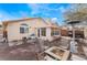 Backyard featuring brick pavers, a sun room addition, outdoor seating, and a barbecue grill at 2903 Galena Peak Ln, Las Vegas, NV 89156