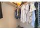 Well-organized walk-in closet with clothes hanging on racks and shoes neatly arranged below at 2903 Galena Peak Ln, Las Vegas, NV 89156