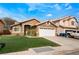 Charming single-story home with a two-car garage and well-maintained lawn at 2903 Galena Peak Ln, Las Vegas, NV 89156