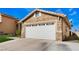 Two-car garage with white doors and well-maintained driveway at 2903 Galena Peak Ln, Las Vegas, NV 89156