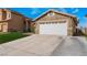Two-car garage with white doors and well-maintained driveway at 2903 Galena Peak Ln, Las Vegas, NV 89156