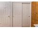 Hallway featuring white doors and a wood cabinet at 2903 Galena Peak Ln, Las Vegas, NV 89156
