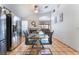 Kitchen with dining area with sleek chairs, and fireplace in background at 2903 Galena Peak Ln, Las Vegas, NV 89156