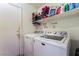 Functional laundry room with a washer and dryer, offering convenience at 2903 Galena Peak Ln, Las Vegas, NV 89156