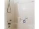 Bright, tiled shower showcasing built-in shelving for soaps and toiletries at 2903 Galena Peak Ln, Las Vegas, NV 89156