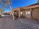 Beautiful backyard featuring a covered patio and desert landscaping, creating a serene outdoor environment at 2925 Big Green Ln, Las Vegas, NV 89134