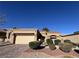 Charming single-story home with desert landscaping, a brick driveway, and an attached garage at 2925 Big Green Ln, Las Vegas, NV 89134