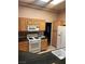 Functional kitchen featuring granite countertops, white appliances, and plenty of cabinet space at 2925 Big Green Ln, Las Vegas, NV 89134
