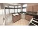 Lovely kitchen with ample cabinet space, tile flooring, and updated appliances at 2925 Big Green Ln, Las Vegas, NV 89134