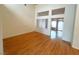 Open living room with hardwood floors, lots of natural light, and neutral colored walls at 2925 Big Green Ln, Las Vegas, NV 89134