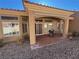 Inviting covered patio with tile flooring, offering a charming outdoor living space for relaxing and entertaining at 2925 Big Green Ln, Las Vegas, NV 89134