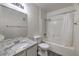 Bright bathroom with granite countertop and shower-tub combination at 3058 Tarpon Dr # 103, Las Vegas, NV 89120