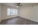 Bright bedroom features stylish gray wood flooring and large window with view at 3058 Tarpon Dr # 103, Las Vegas, NV 89120