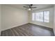 Bright bedroom features stylish gray wood flooring and a large window at 3058 Tarpon Dr # 103, Las Vegas, NV 89120