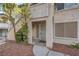 Exterior view of condo with landscaped entrance at 3058 Tarpon Dr # 103, Las Vegas, NV 89120