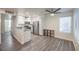Open-concept kitchen and living area with modern fixtures and stainless appliances at 3058 Tarpon Dr # 103, Las Vegas, NV 89120
