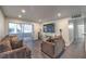 Comfortable living area with large sliding glass door, TV, and open to kitchen at 3058 Tarpon Dr # 103, Las Vegas, NV 89120