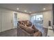 Inviting living room features a comfortable couch and sliding door to a private balcony at 3058 Tarpon Dr # 103, Las Vegas, NV 89120