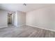 Spacious bedroom with contemporary flooring, neutral paint, and a walk-in closet at 3151 Soaring Gulls Dr # 1145, Las Vegas, NV 89128