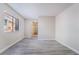Well-lit bedroom with contemporary floors, closet, and a view to exterior landscape at 3151 Soaring Gulls Dr # 1145, Las Vegas, NV 89128