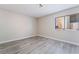 Bright, neutral bedroom with modern floors and natural light from a window at 3151 Soaring Gulls Dr # 1145, Las Vegas, NV 89128