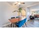 A stylish dining area with views into the living room, showcasing modern furnishings and a comfortable atmosphere at 3151 Soaring Gulls Dr # 1145, Las Vegas, NV 89128