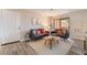 Bright living room featuring two modern sofas, contemporary decor, and a sliding glass door leading to the patio at 3151 Soaring Gulls Dr # 1145, Las Vegas, NV 89128