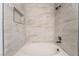 Relaxing shower featuring contemporary tile, built-in niche, and modern showerhead at 3151 Soaring Gulls Dr # 1145, Las Vegas, NV 89128
