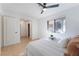 Inviting bedroom with tile flooring, ceiling fan, and a window providing natural light at 3151 Soaring Gulls Dr # 1168, Las Vegas, NV 89128