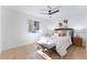 Cozy bedroom features tile flooring, a ceiling fan, and a comfortable bed with accent pillows at 3151 Soaring Gulls Dr # 1168, Las Vegas, NV 89128