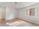 Bedroom with neutral colors, tile floors, and a window with natural light at 3151 Soaring Gulls Dr # 1168, Las Vegas, NV 89128