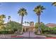 Community clubhouse framed by lush landscaping and towering palm trees at 3151 Soaring Gulls Dr # 1168, Las Vegas, NV 89128