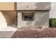Building exterior with stone landscaping and a glimpse of the staircase to the second level at 3151 Soaring Gulls Dr # 1168, Las Vegas, NV 89128