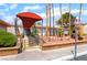 The exterior entrance of this apartment complex features a covered walkway and well-maintained landscaping at 3151 Soaring Gulls Dr # 1168, Las Vegas, NV 89128