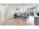 Bright living room with neutral decor, tile floors, and sliding glass doors at 3151 Soaring Gulls Dr # 1168, Las Vegas, NV 89128