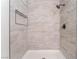 Tiled shower featuring mosaic accents, a shower niche, and modern matte black fixtures at 3151 Soaring Gulls Dr # 1168, Las Vegas, NV 89128