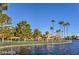 This shot shows a beautiful lakefront recreational area with picnic gazebos and lush landscaping at 3151 Soaring Gulls Dr # 1168, Las Vegas, NV 89128