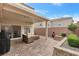 Outdoor patio featuring paver flooring, stone fireplace, and comfortable patio seating at 3636 Gainsville St, Las Vegas, NV 89129