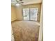 Bedroom featuring tan carpeting and sliding glass doors to the exterior at 3729 La Junta Dr, Las Vegas, NV 89120